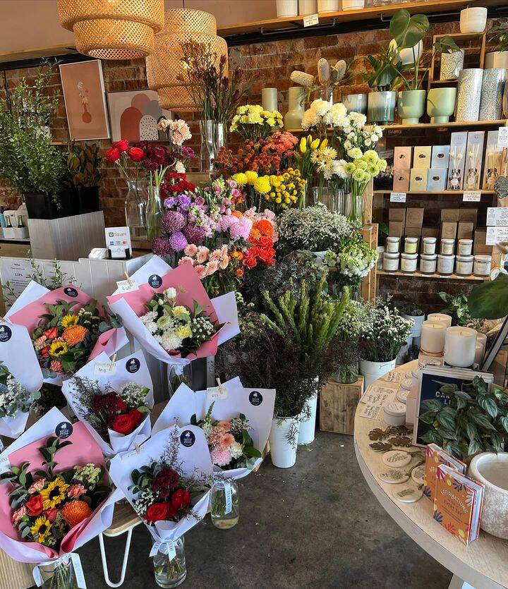 Local Torrance florist preparing fresh flower arrangements for customers